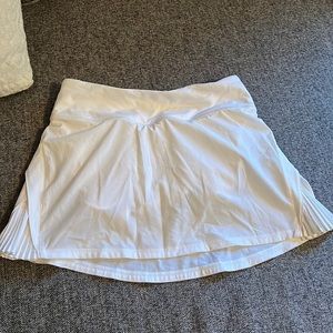 Lululemon white tennis skirt with side pleat. Size 2
